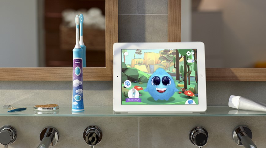 dětský zubní kartáček s aplikací pro čištění zubů spuštěnou na tabletu