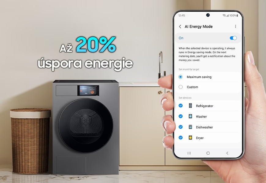 Sušičky Samsung v energetické třídě A: Sušte prádlo úsporně a efektivně! V popředí je ruka držící mobilní telefon s aplikací SmartThings zobrazující AI Energy režim, na pozadí je sušička s prádelním košem vedle dřezu, nápis Až 20% úspora energie.