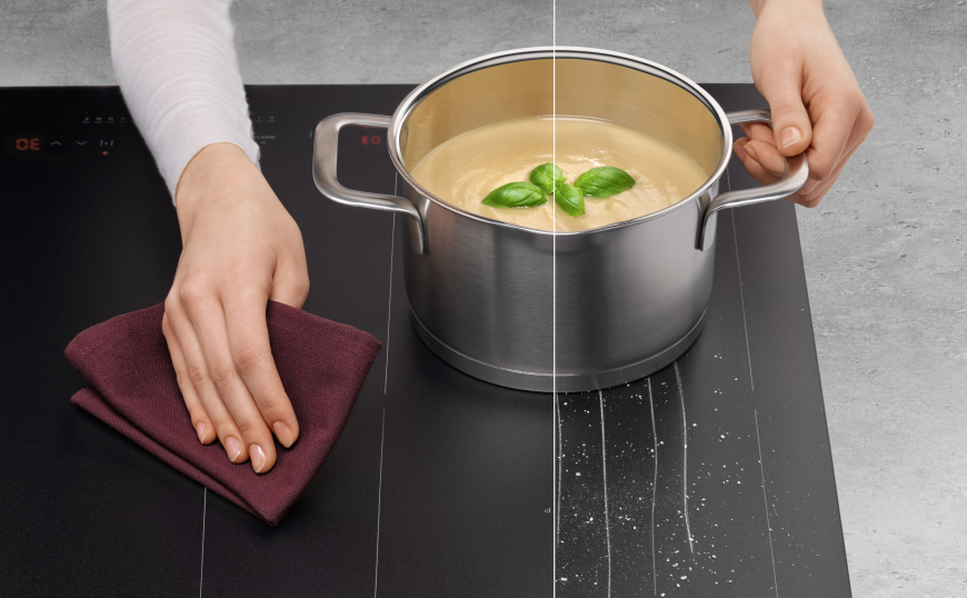 Matné indukční desky Amica – elegance, odolnost a maximální výkon Žena vaří a čistí matnou indukční desku Amica