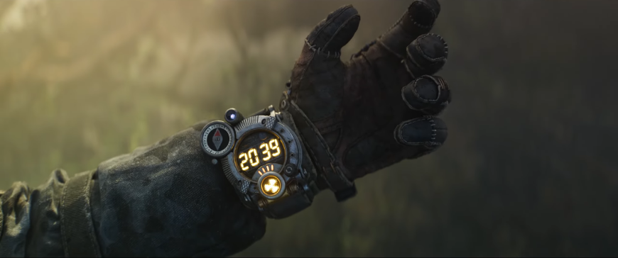 Ruka s hodinkami s časem 20:39 - screenshot z traileru na Metro 2039