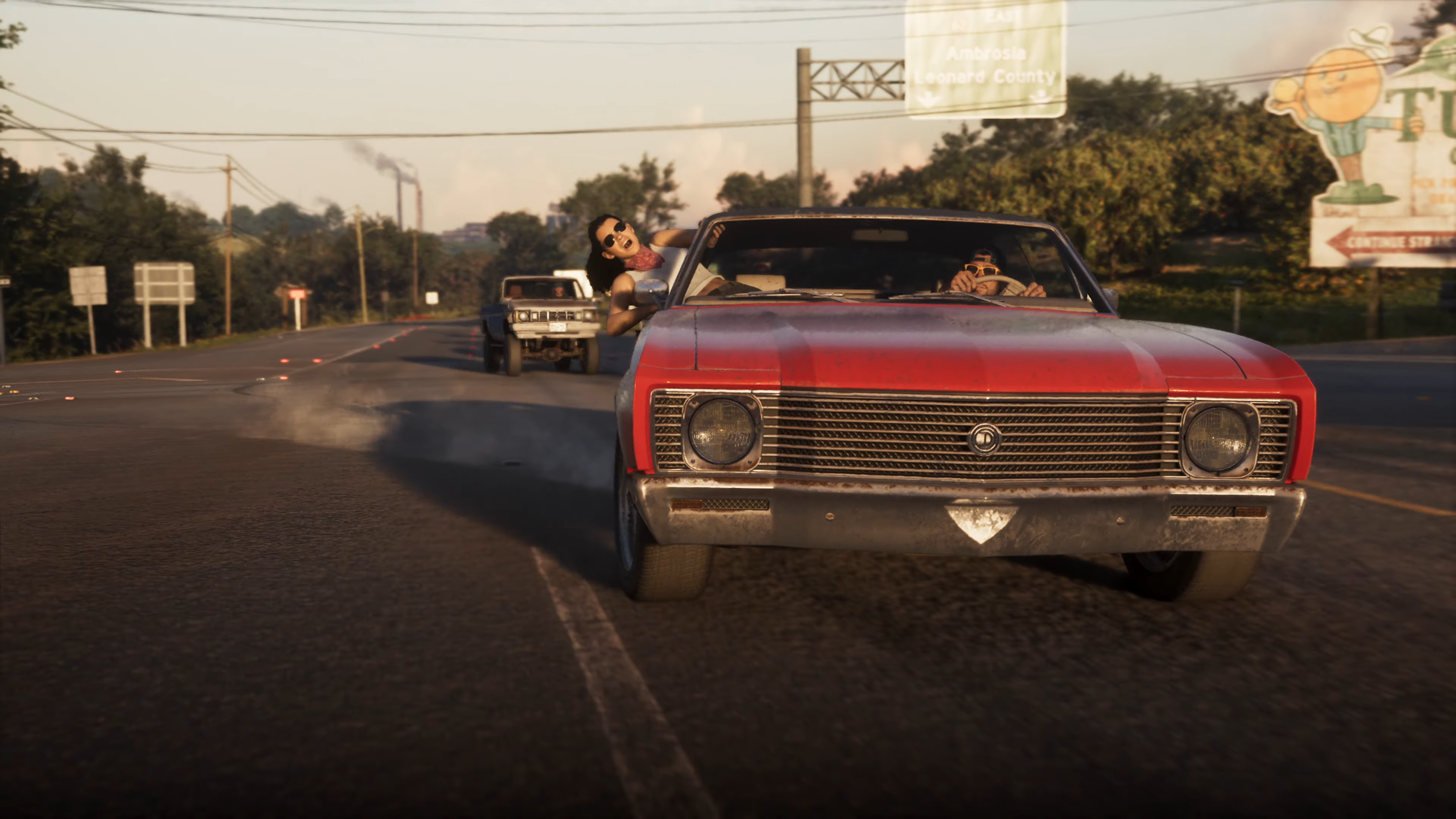 Grand Theft Auto VI: Vše o nejočekávanější hře desetiletí – předobjednávky spuštěny (aktualizováno) Jason a Lucia jedou v červeném autě, Lucia se vyklání z okénka, screenshot z ukázky ze hry