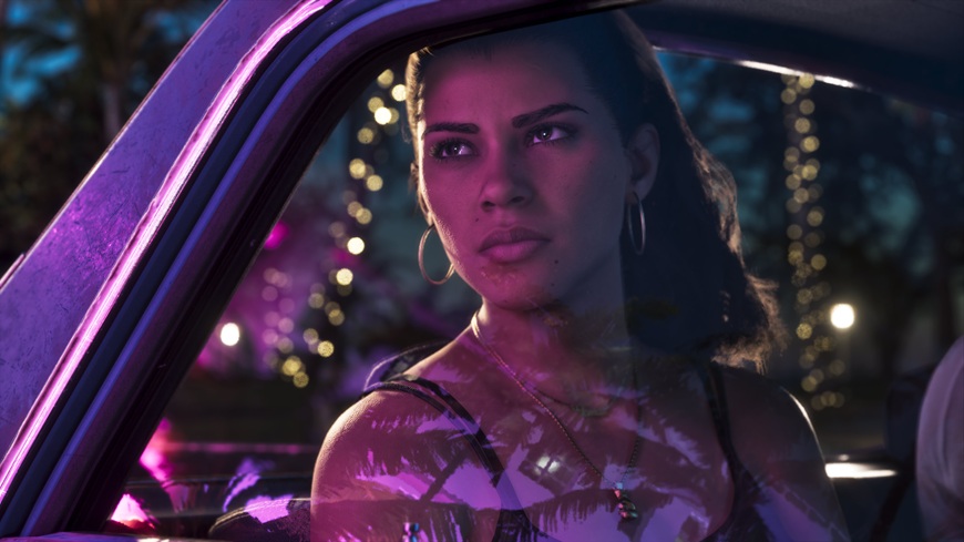 Lucia sedí v autě a dívá se ven z okénka, ve kterém se odrážejí noční světla Vice City