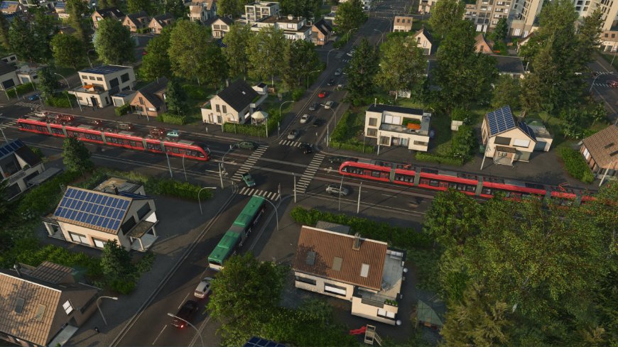 Transport Fever 3: Vybuduj ještě větší dopravní impérium v novém simulátoru Železniční trať vedoucí městem z výšky, na dráze jede vlak, záběr ze hry Transport Fever 3