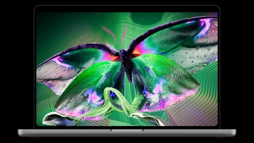 Láska na první PROLED! Apple do třetice všeho nového představil první dotykový MacBook Pro MacBook Pro s PROLED XDR displejem, na němž je vyobrazen kontrastně zbarvený motýl